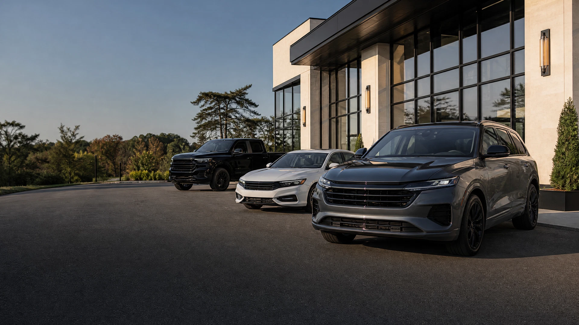 Premium pre-owned vehicles outside a modern Greenwich dealership